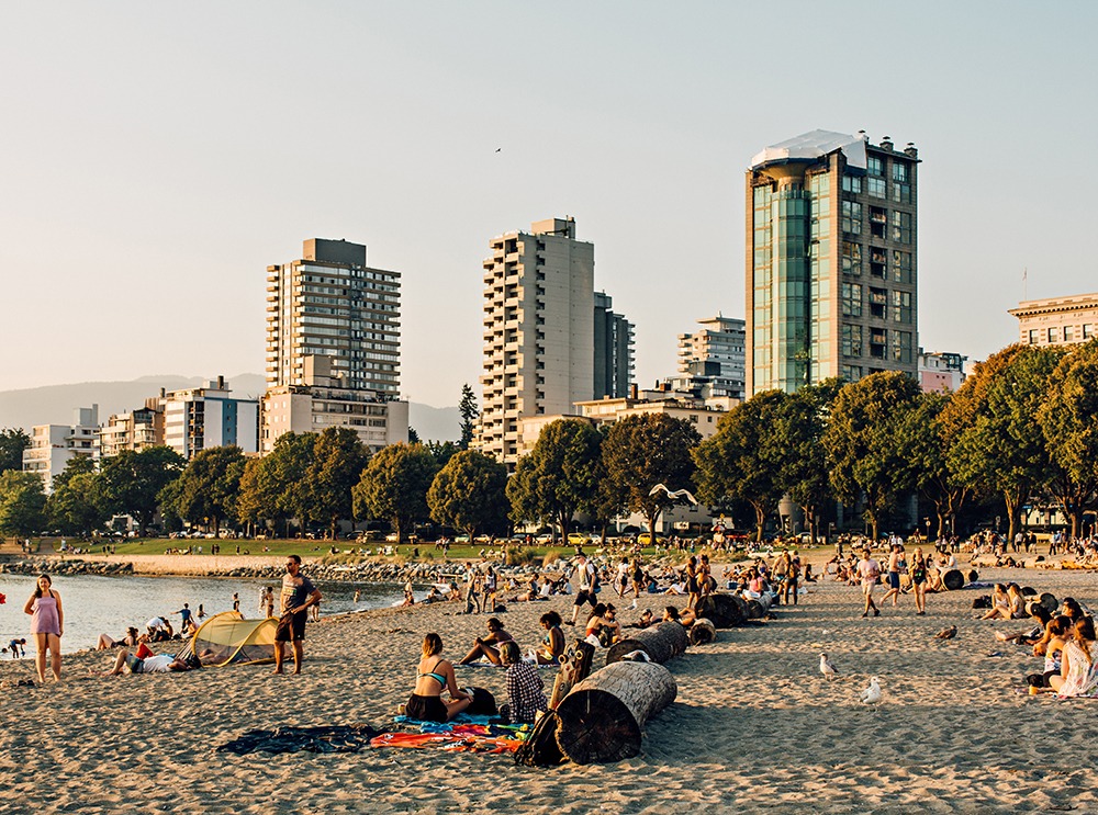 People enjoying English Bay beach, Vancouver, BC